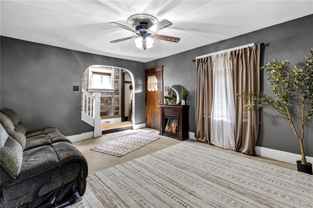 1201 5th Avenue Freedom, PA 15042 - Photo 7 of 32 a bedroom with a bed and a chandelier