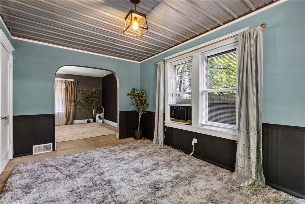 1201 5th Avenue Freedom, PA 15042 - Photo 8 of 32 a bedroom with a bed and a large window