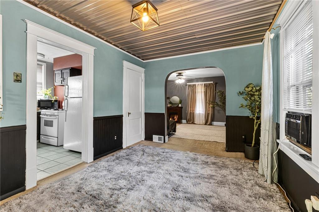 1201 5th Avenue Freedom, PA 15042 - Photo 10 of 32 a view of a hallway with wooden floor and furniture