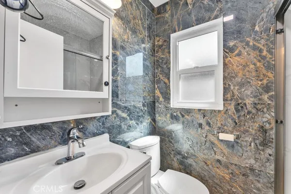 a bathroom with a sink and a toilet