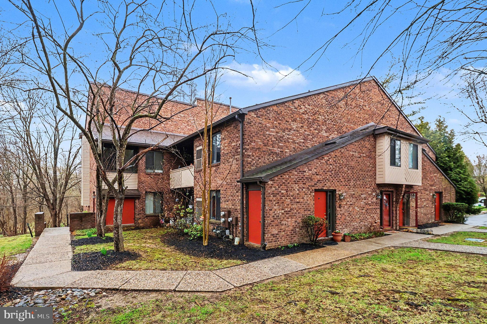 910 Mountainview Drive, Unit 910 Chesterbrook, PA 19087 - Photo 2 of 27 a view of a house with a yard