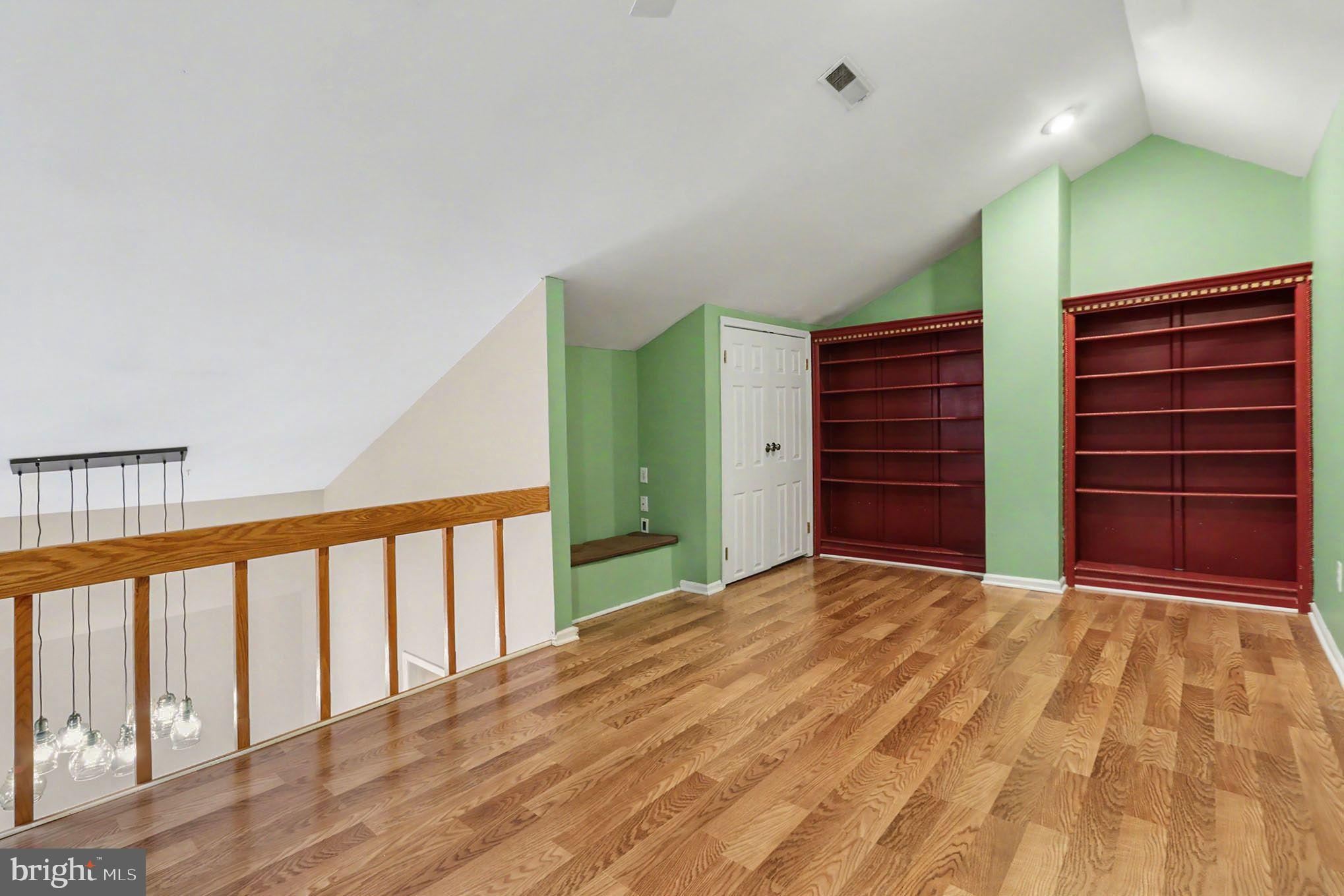 910 Mountainview Drive, Unit 910 Chesterbrook, PA 19087 - Photo 21 of 27 a view of an empty room with a window and wooden floor