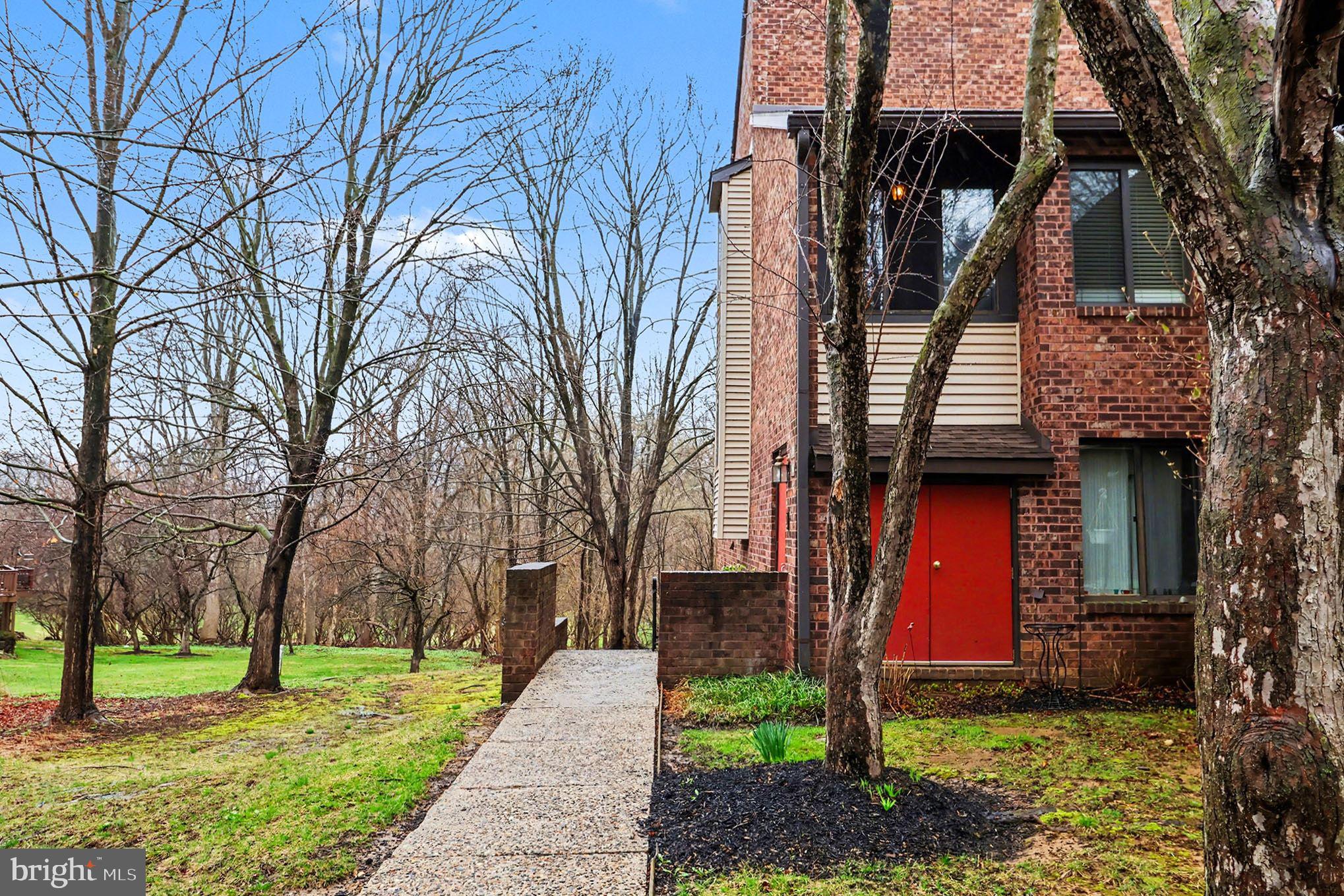 910 Mountainview Drive, Unit 910 Chesterbrook, PA 19087 - Photo 5 of 27 a front view of a house with a yard
