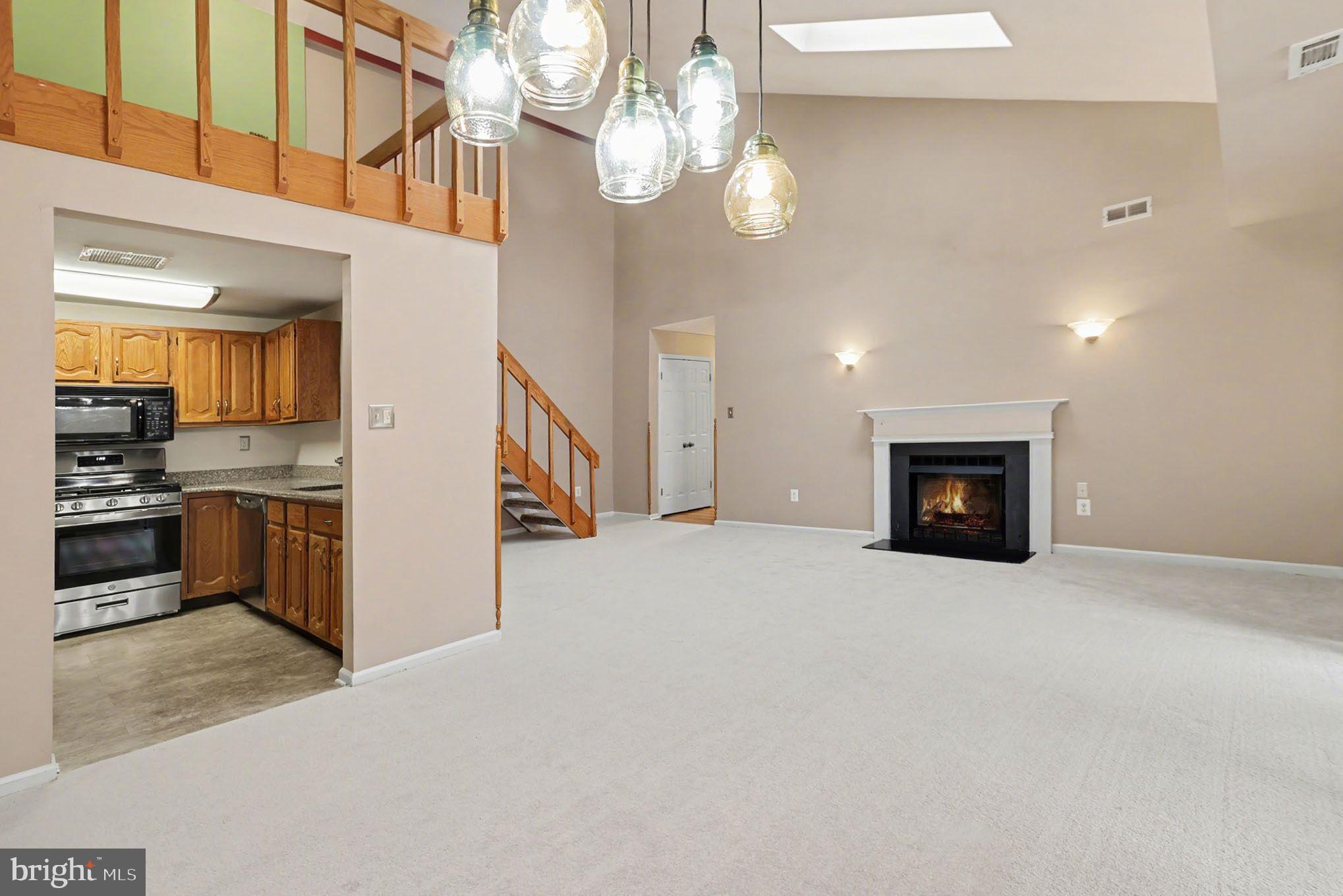 910 Mountainview Drive, Unit 910 Chesterbrook, PA 19087 - Photo 8 of 27 a view of a kitchen with a sink and a fireplace