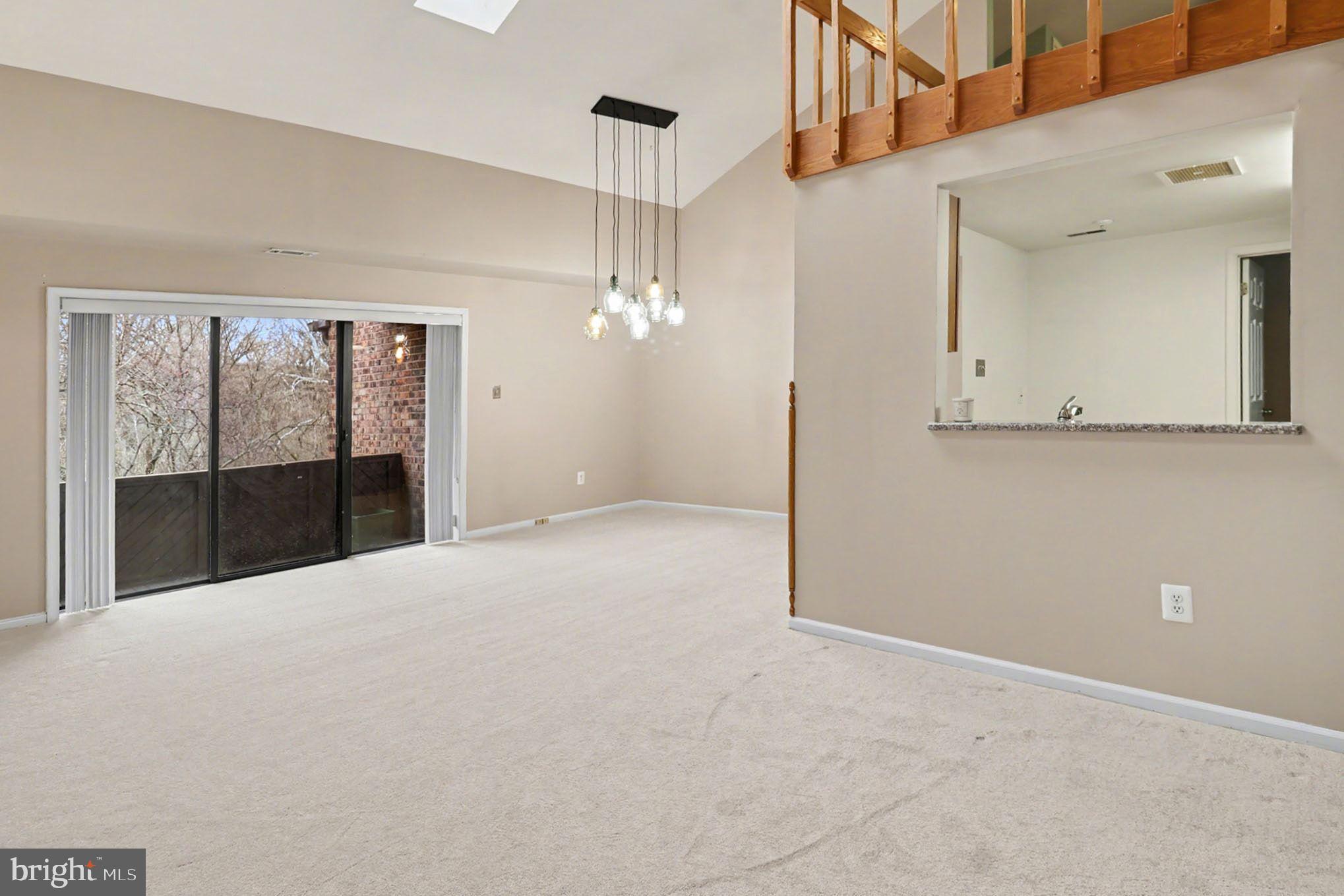 910 Mountainview Drive, Unit 910 Chesterbrook, PA 19087 - Photo 9 of 27 a view of a hallway with an entryway and chandelier fan