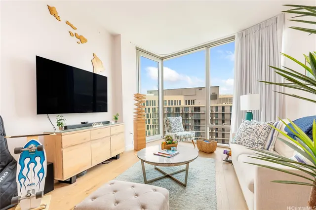 a living room with furniture and a flat screen tv