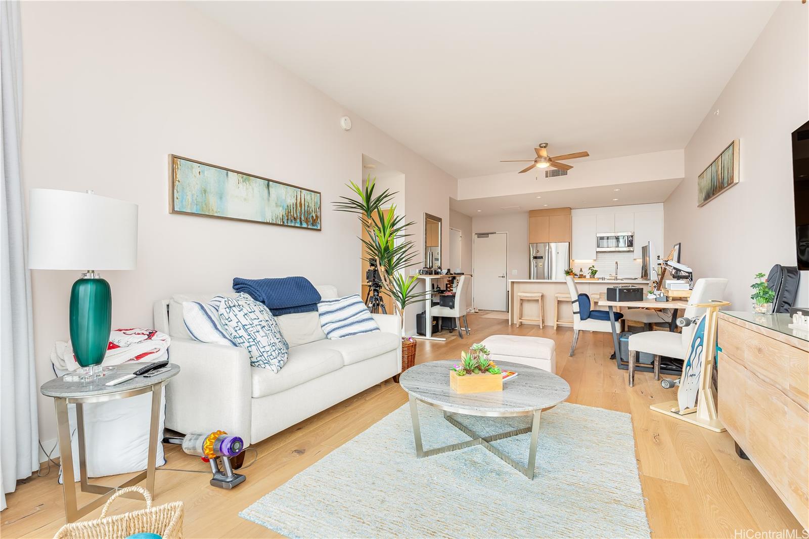 1001 Queen Street, Unit 3907 Honolulu, HI 96814 - Photo 8 of 25 a living room with furniture and wooden floor