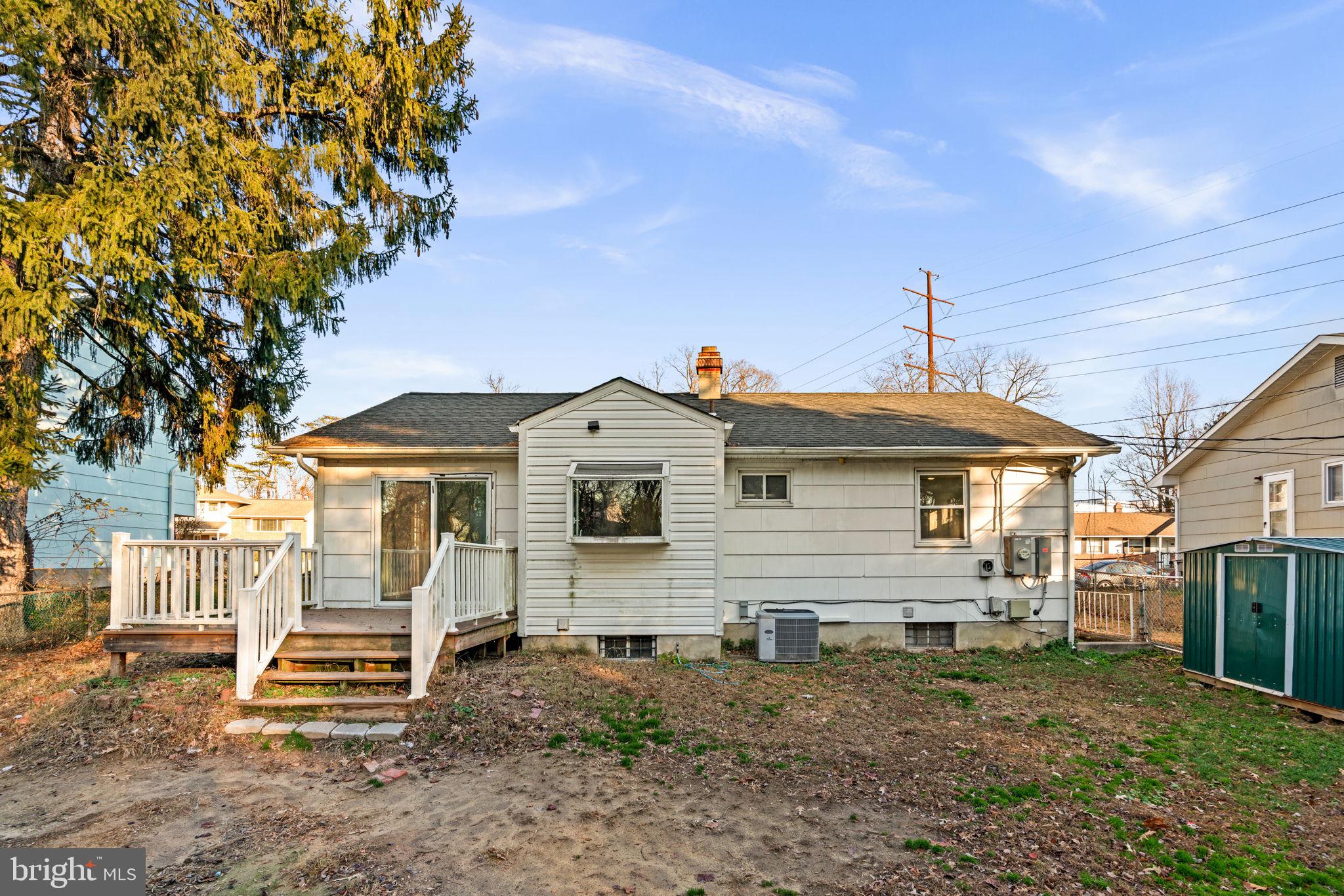 8111 Phirne Road East Glen Burnie, MD 21061 - Photo 29 of 30 a front view of a house with a yard