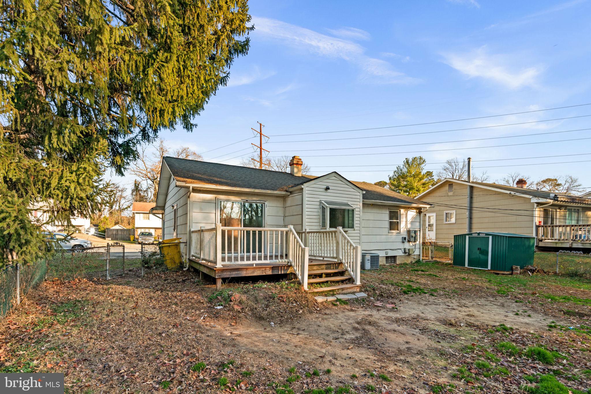 8111 Phirne Road East Glen Burnie, MD 21061 - Photo 30 of 30 a view of a house with a yard and roof