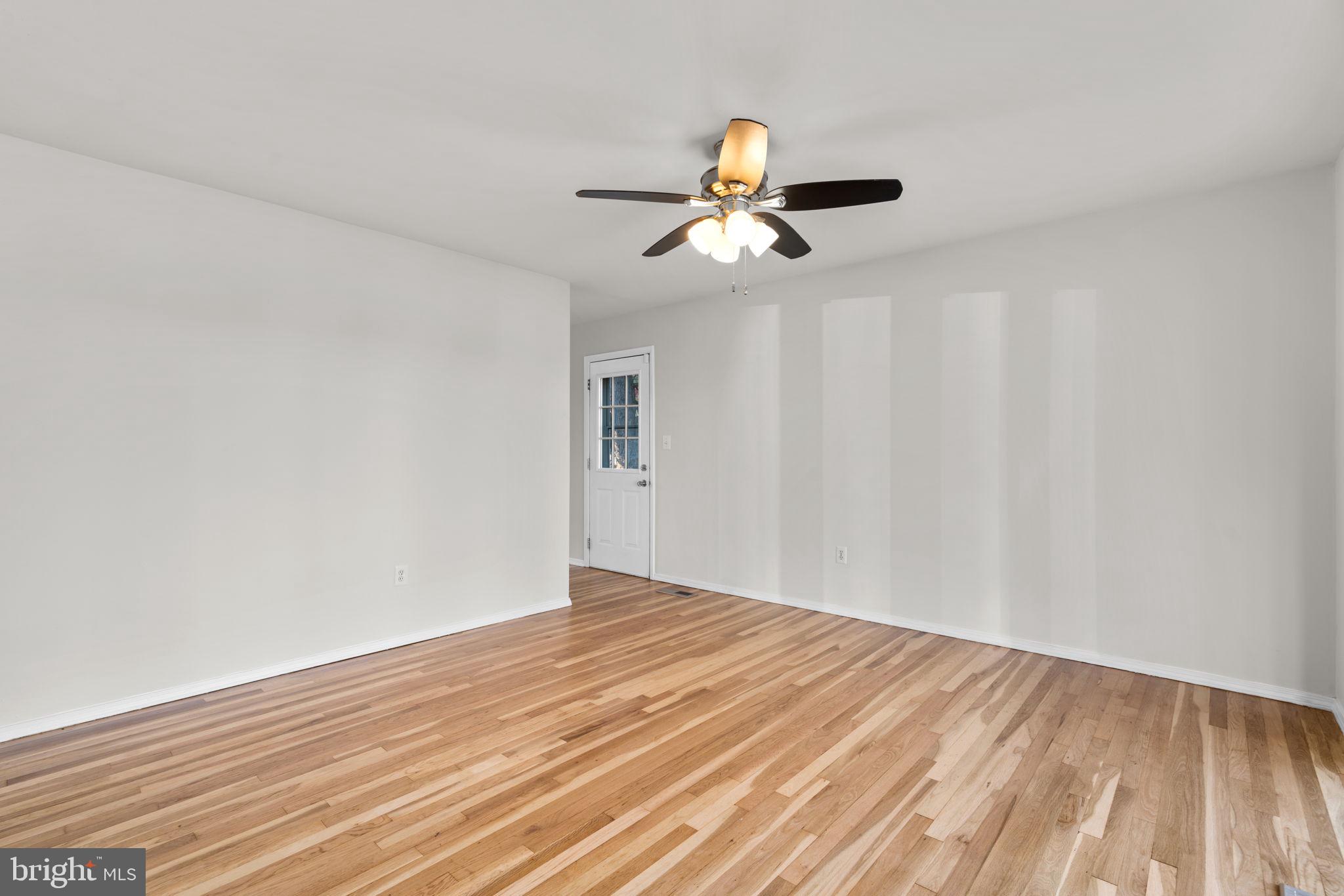 8111 Phirne Road East Glen Burnie, MD 21061 - Photo 4 of 30 a view of empty room with wooden floor