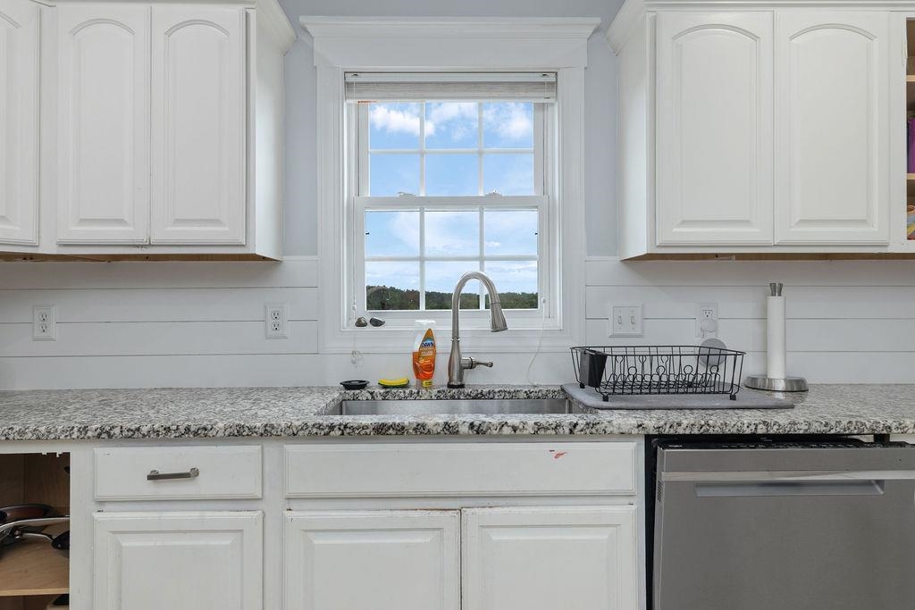 124 Wexford Street Staunton, VA 24401 - Photo 21 of 31 a kitchen with granite countertop white cabinets and a sink