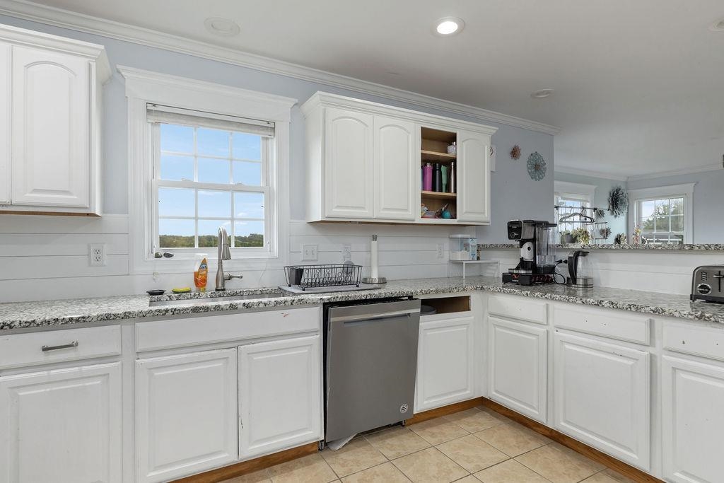 124 Wexford Street Staunton, VA 24401 - Photo 22 of 31 a kitchen with white cabinets sink and dishwasher