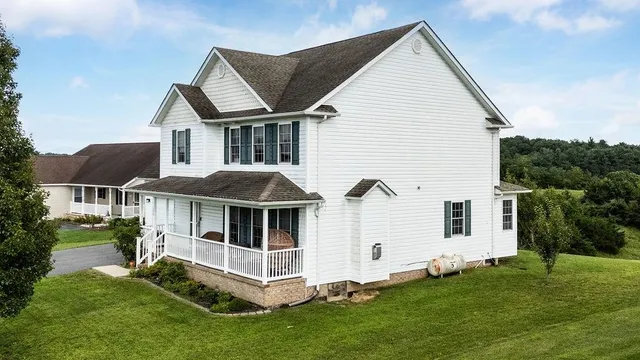 a front view of a house with a yard
