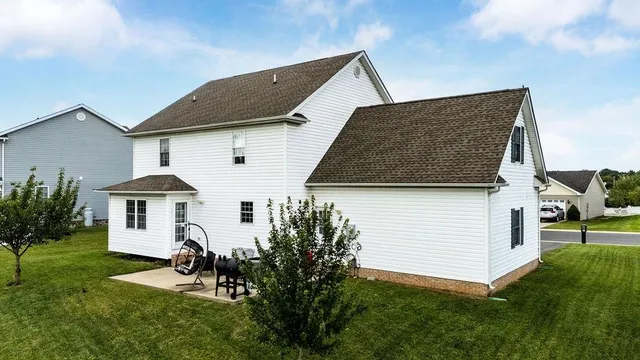 a front view of a house with a yard
