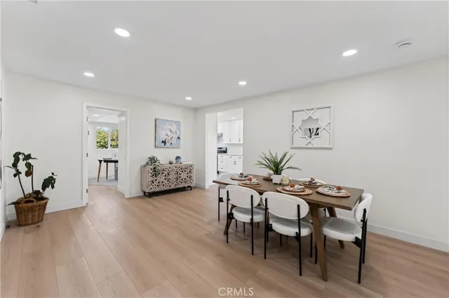 a view of a livingroom with furniture and wooden floor
