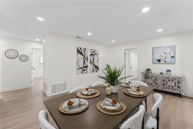 a view of a dining room and kitchen