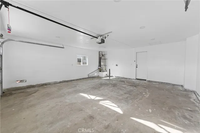 a view of a livingroom with an empty space and a ceiling fan