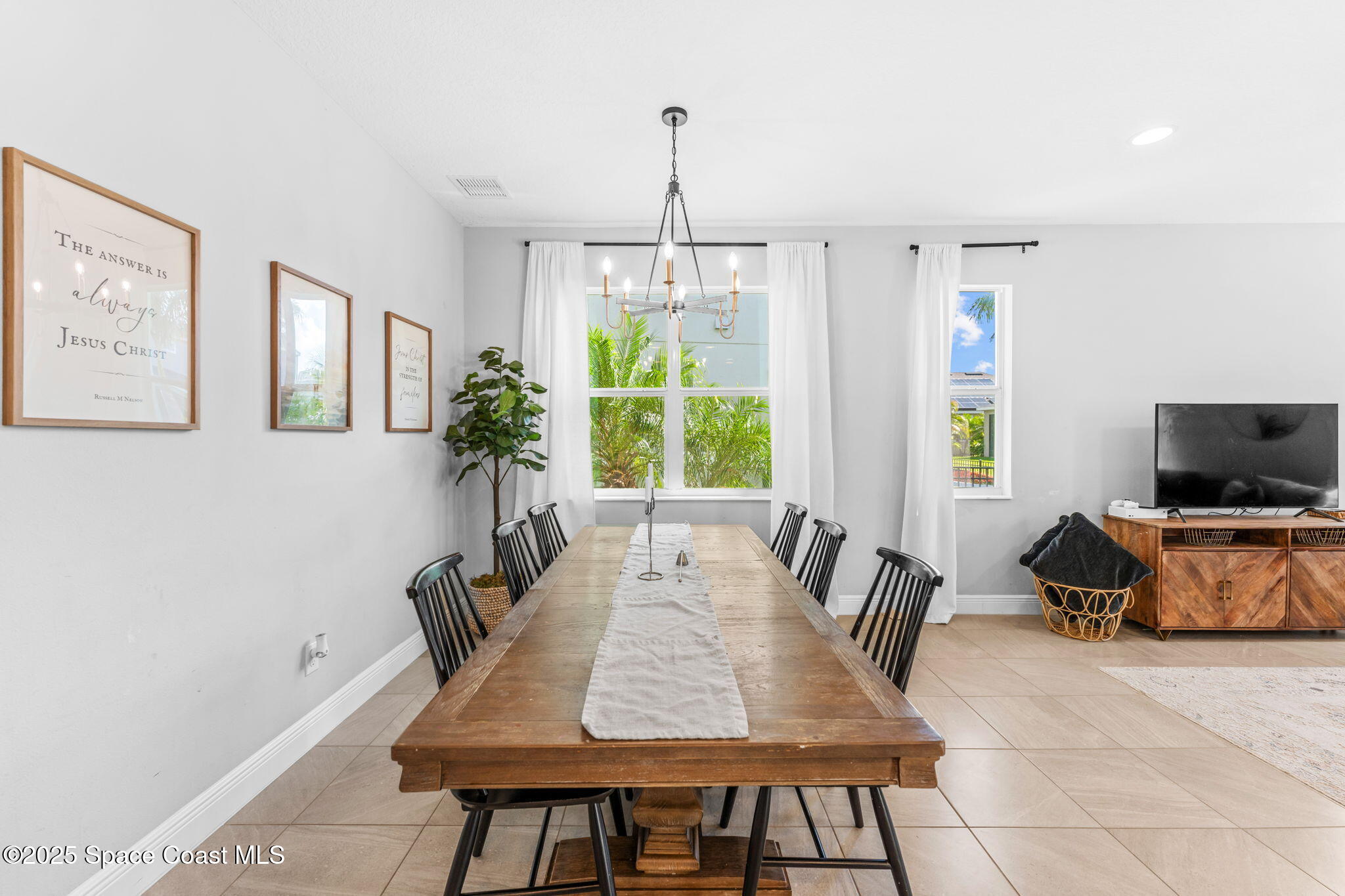 3089 Ribbon Grass Drive Melbourne, FL 32940 - Photo 12 of 57 a view of a dining room with furniture window and wooden floor