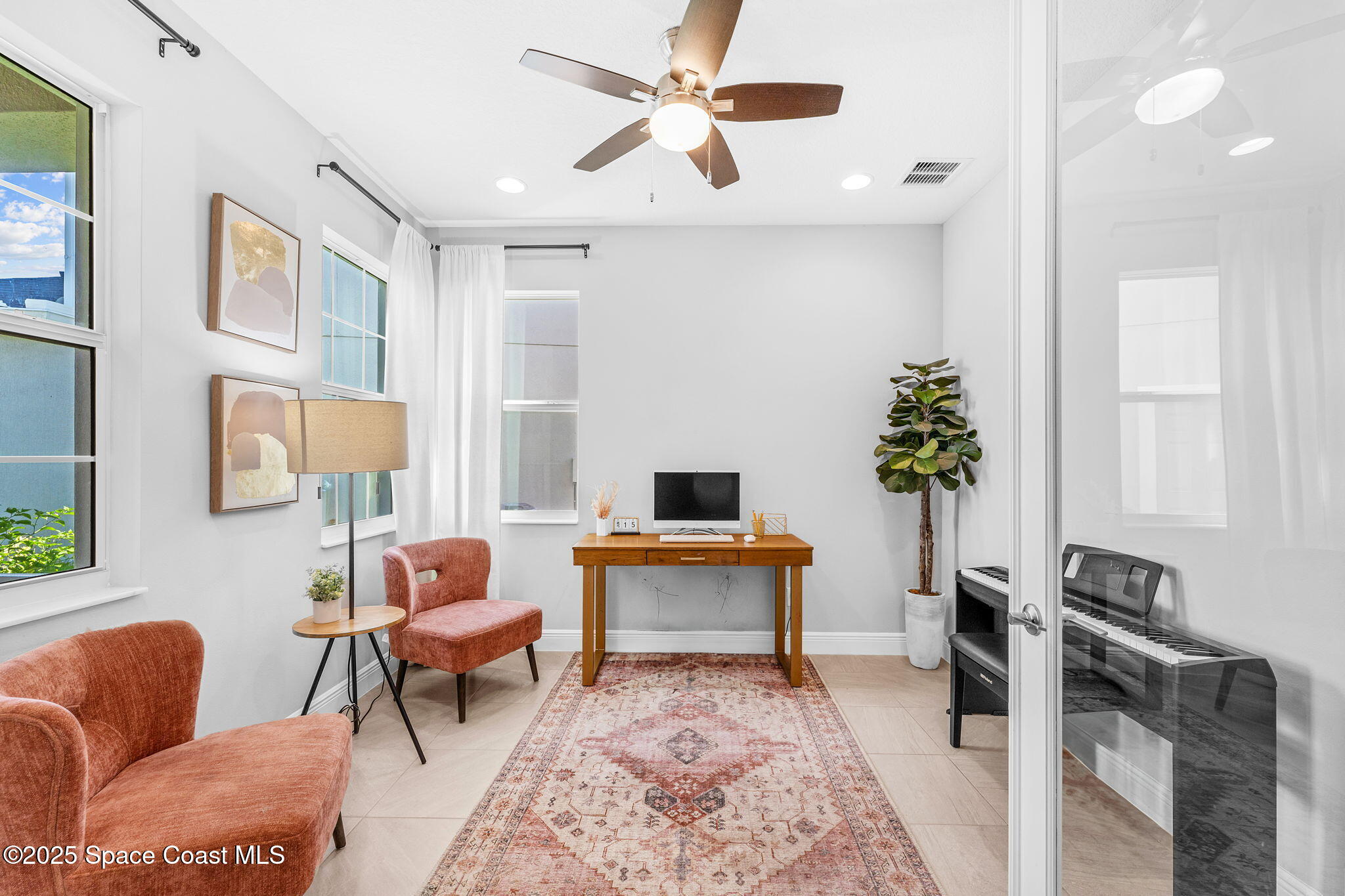 3089 Ribbon Grass Drive Melbourne, FL 32940 - Photo 27 of 57 a living room with furniture a dining table and a potted plant
