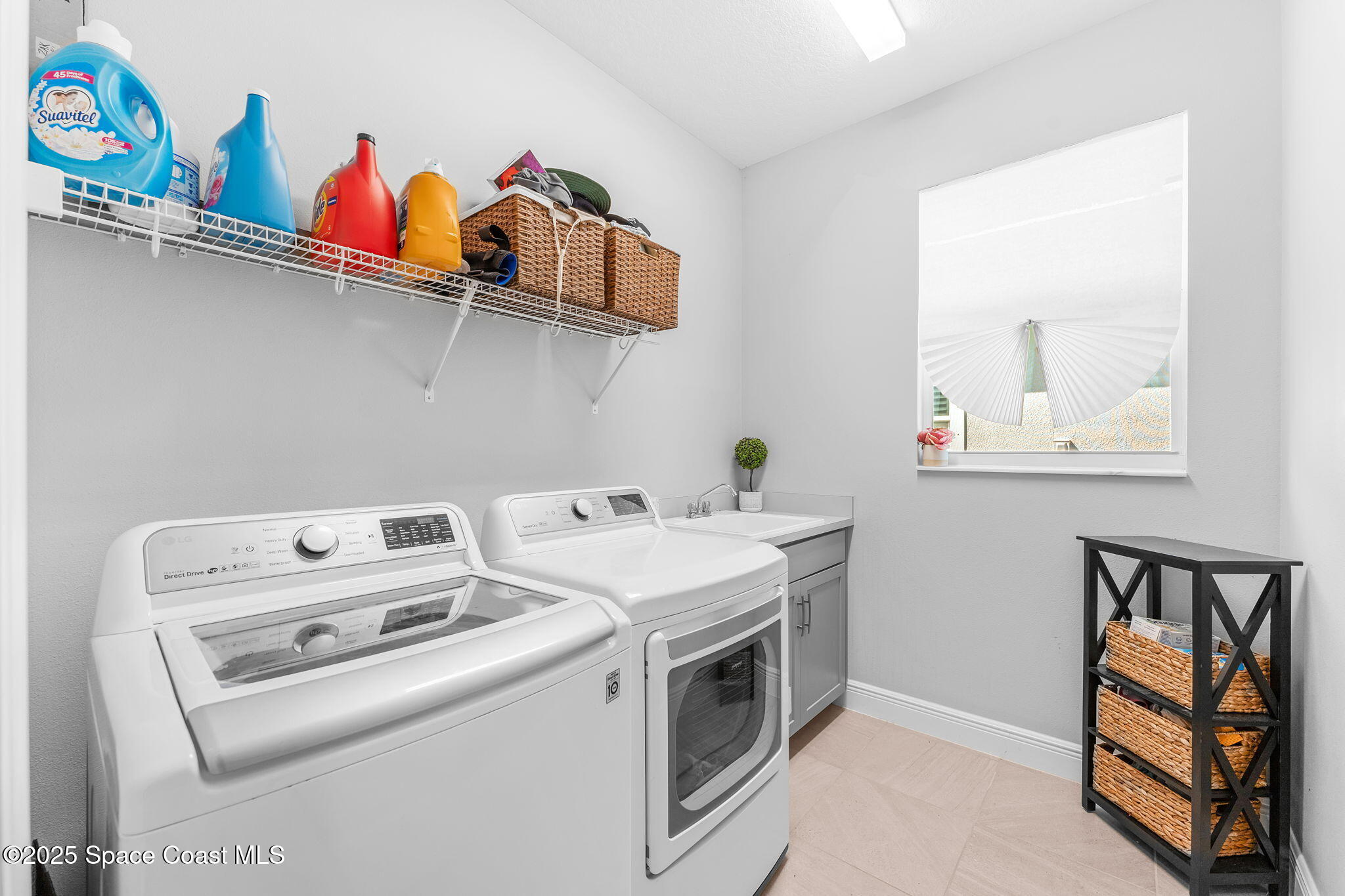 3089 Ribbon Grass Drive Melbourne, FL 32940 - Photo 30 of 57 a utility room with dryer and washer