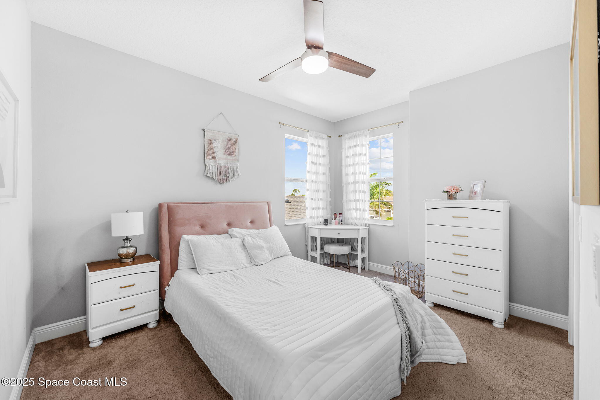 3089 Ribbon Grass Drive Melbourne, FL 32940 - Photo 32 of 57 a bedroom with a bed and a closet