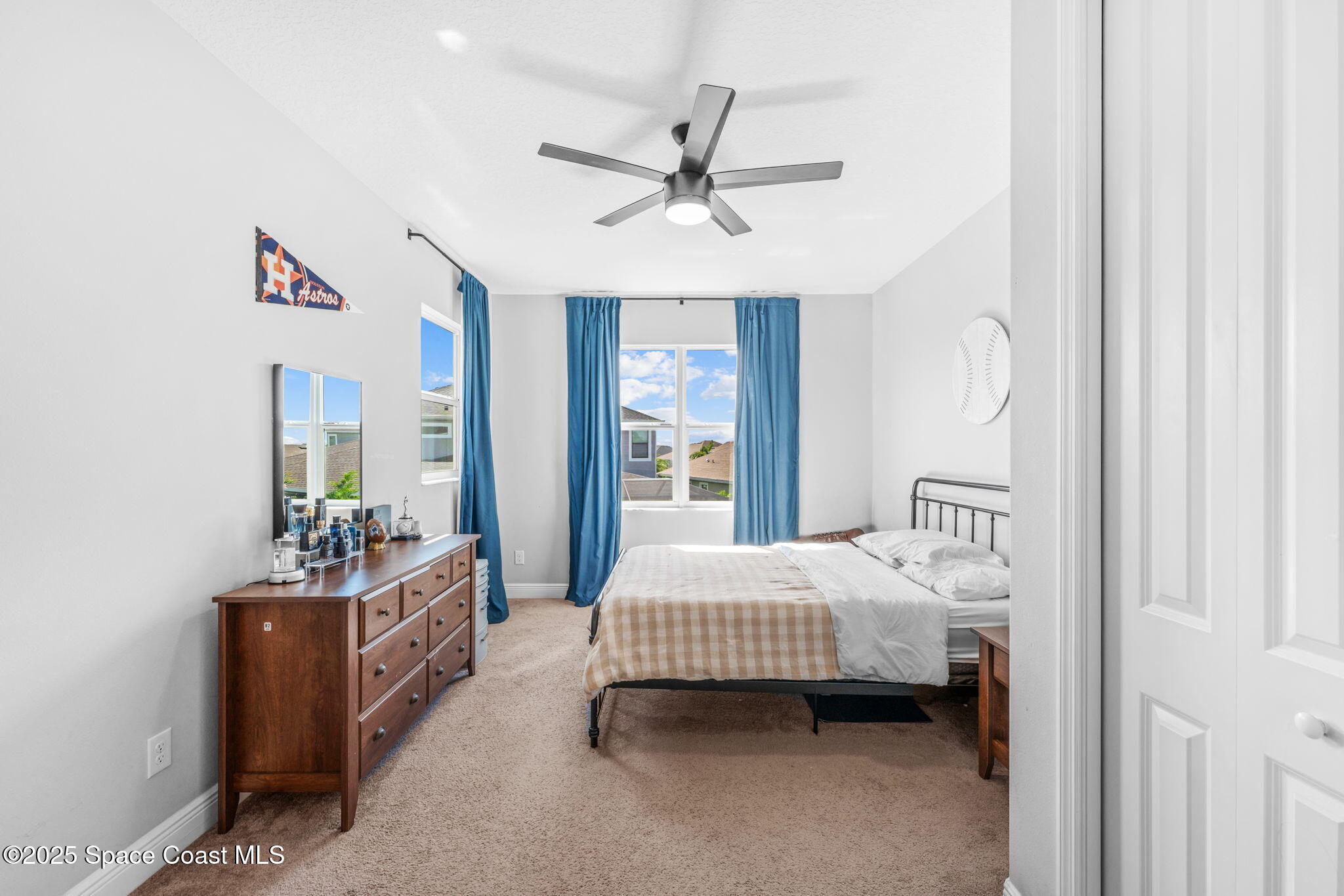 3089 Ribbon Grass Drive Melbourne, FL 32940 - Photo 34 of 57 a bedroom with a bed and a window