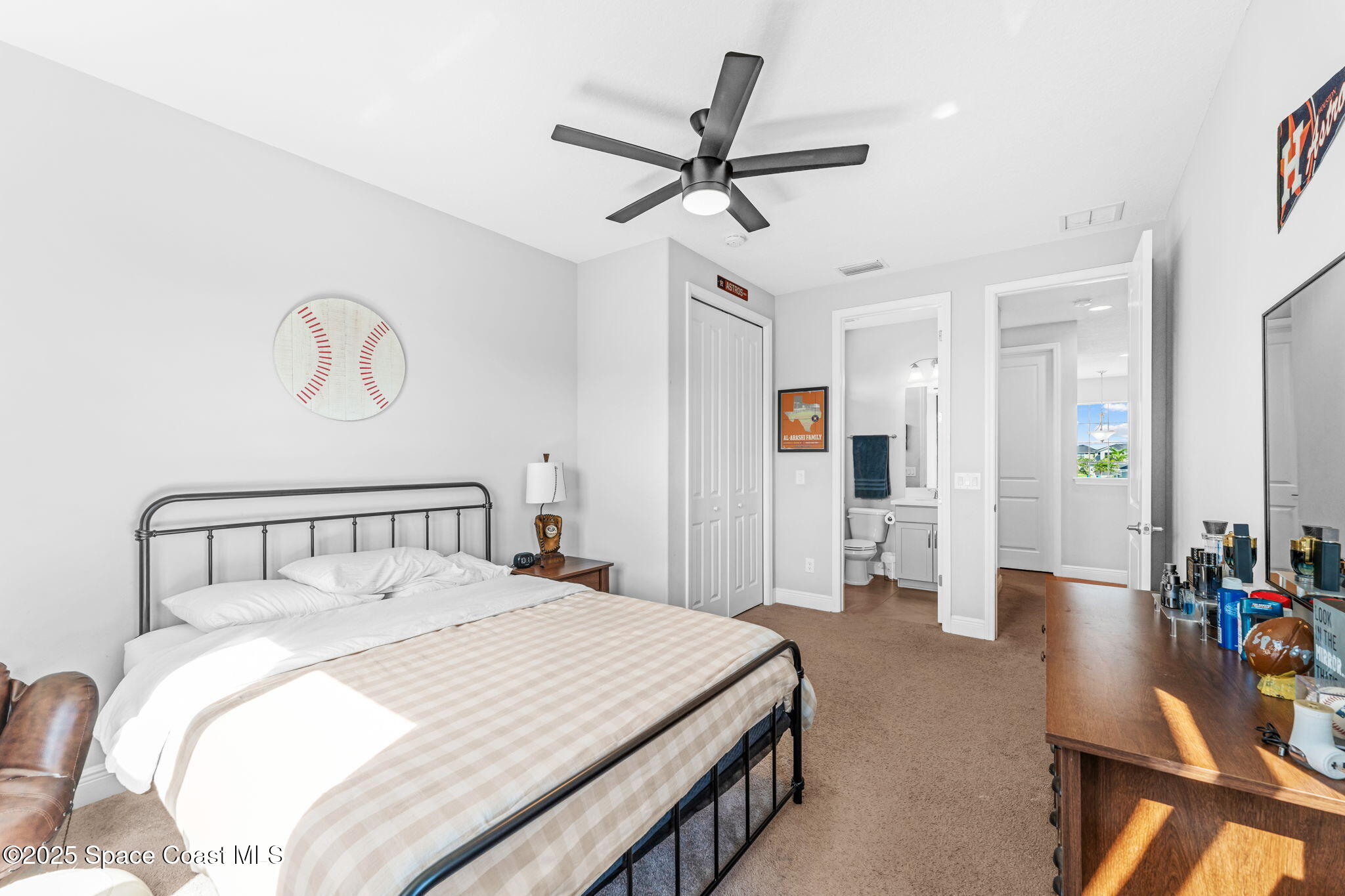 3089 Ribbon Grass Drive Melbourne, FL 32940 - Photo 35 of 57 a bedroom with a bed and ceiling fan