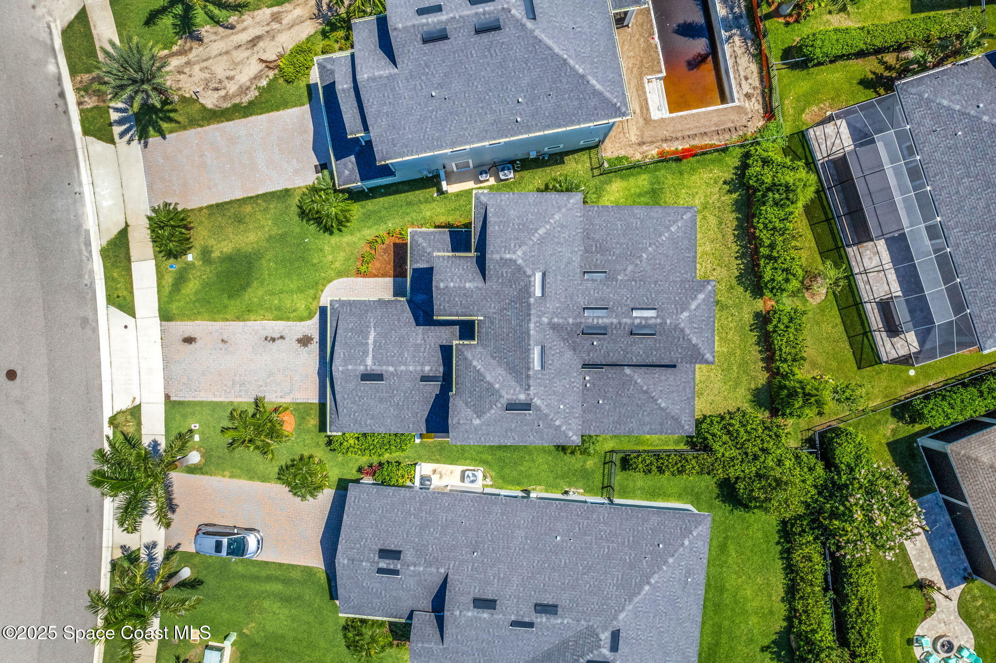 3089 Ribbon Grass Drive Melbourne, FL 32940 - Photo 40 of 57 an aerial view of a house with a garden and a yard