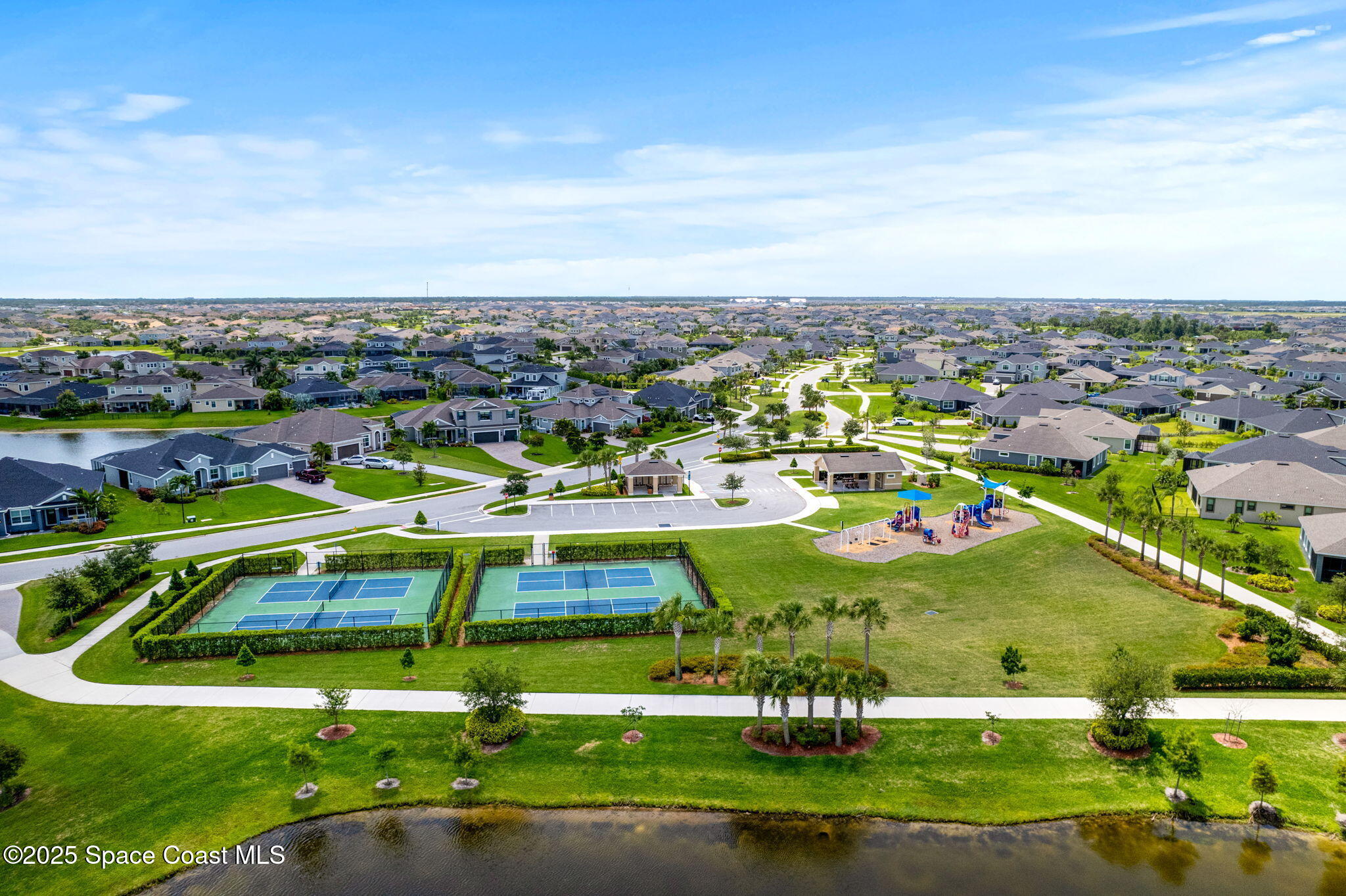 3089 Ribbon Grass Drive Melbourne, FL 32940 - Photo 43 of 57 an aerial view of a house with a big yard