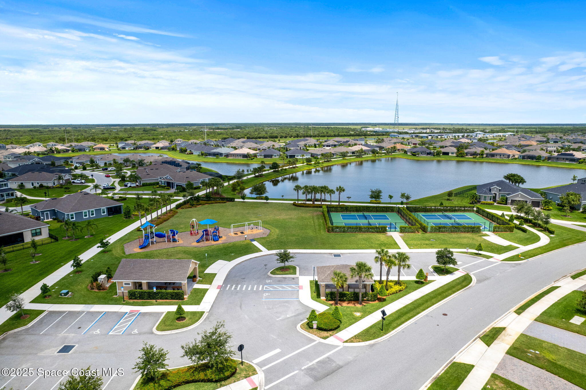 3089 Ribbon Grass Drive Melbourne, FL 32940 - Photo 44 of 57 an aerial view of a city with lawn chairs