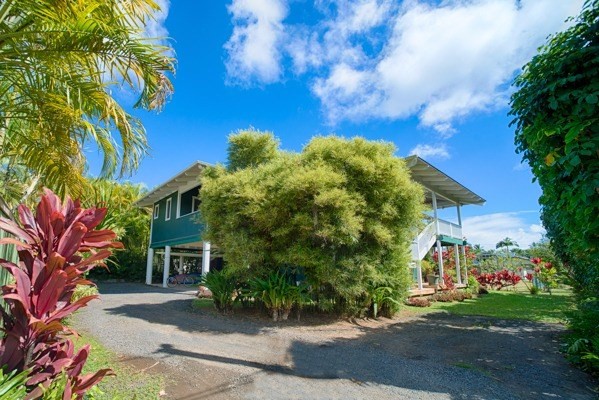 4451 Mahimahi Road Hanalei, HI 96714 - Photo 17 of 25 a front view of a house with a yard