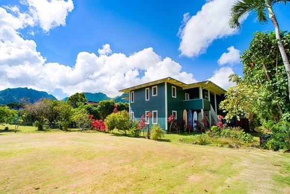 4451 Mahimahi Road Hanalei, HI 96714 - Photo 20 of 25 a front view of a house with a yard and a garage