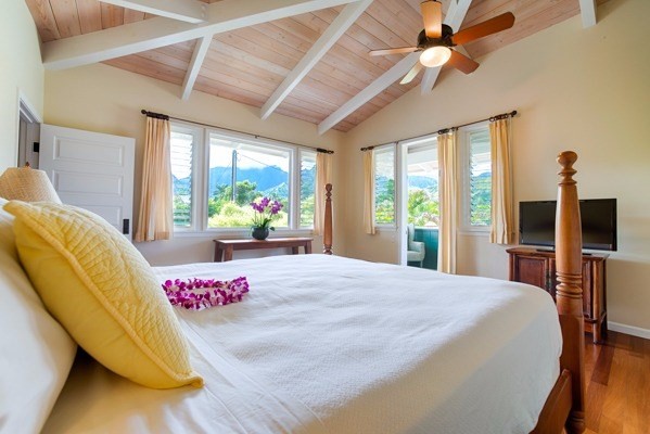 4451 Mahimahi Road Hanalei, HI 96714 - Photo 8 of 25 a bedroom with a bed dresser and a large window