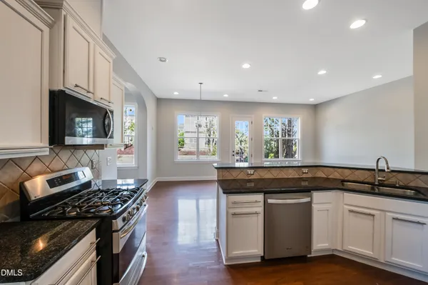 a kitchen with a stove and a sink