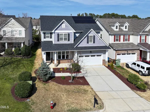 an aerial view of a residential apartment building with a yard