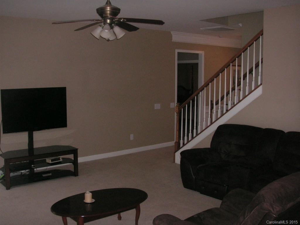 312 Altovista Court Fort Mill, SC 29708 - Photo 13 of 24 a living room with furniture and a lamp