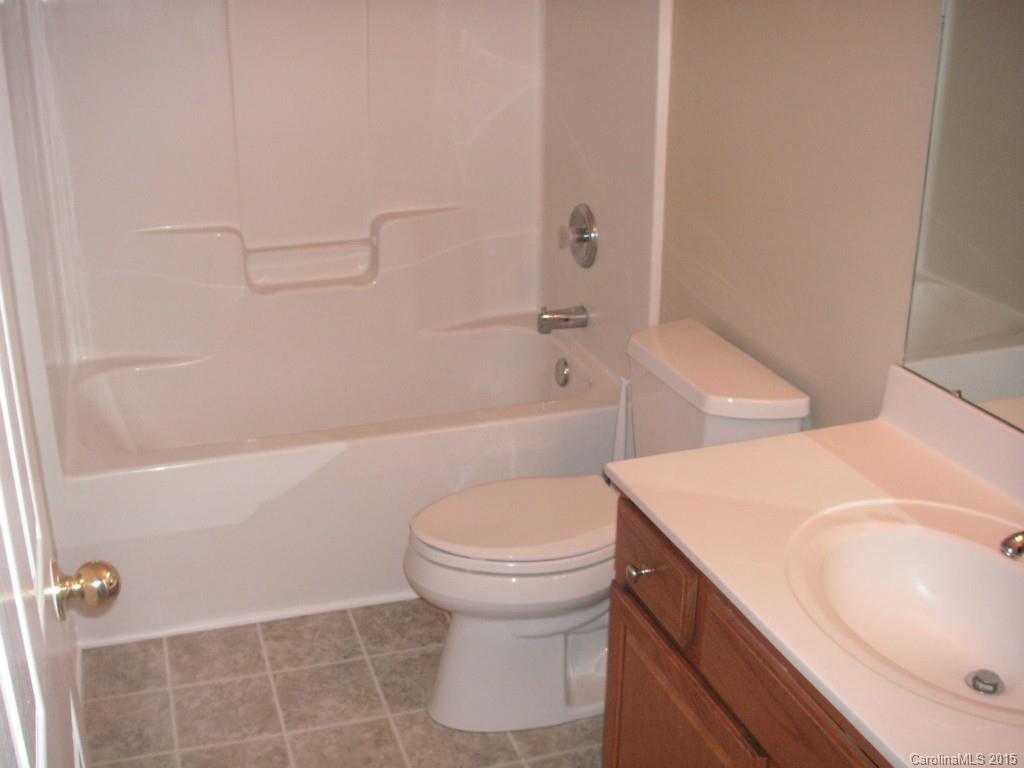 312 Altovista Court Fort Mill, SC 29708 - Photo 19 of 24 a bathroom with a sink a toilet and shower