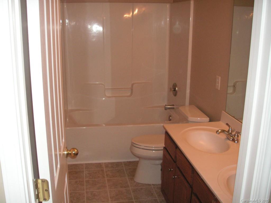 312 Altovista Court Fort Mill, SC 29708 - Photo 21 of 24 a bathroom with a sink a toilet and shower