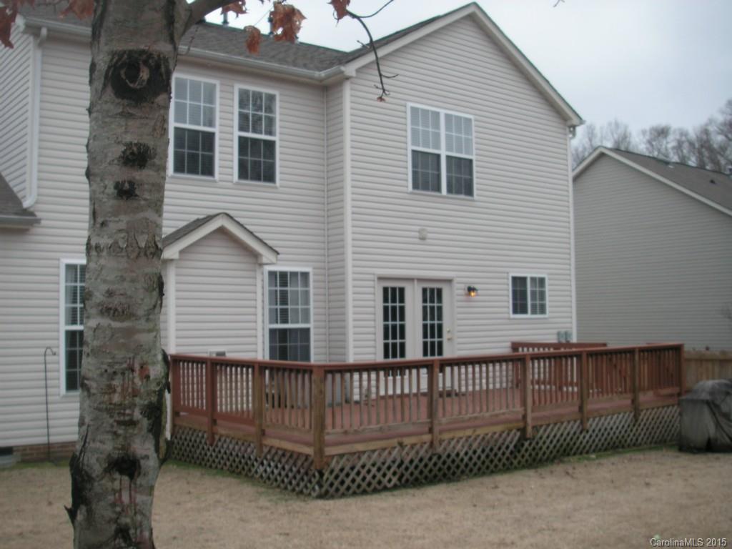 312 Altovista Court Fort Mill, SC 29708 - Photo 23 of 24 a view of a house with a small yard and wooden fence