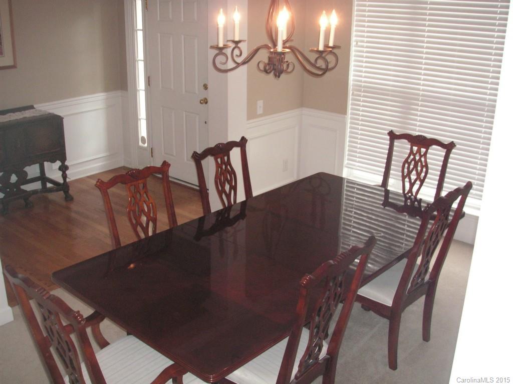 312 Altovista Court Fort Mill, SC 29708 - Photo 4 of 24 a view of a dining room with furniture and wooden floor