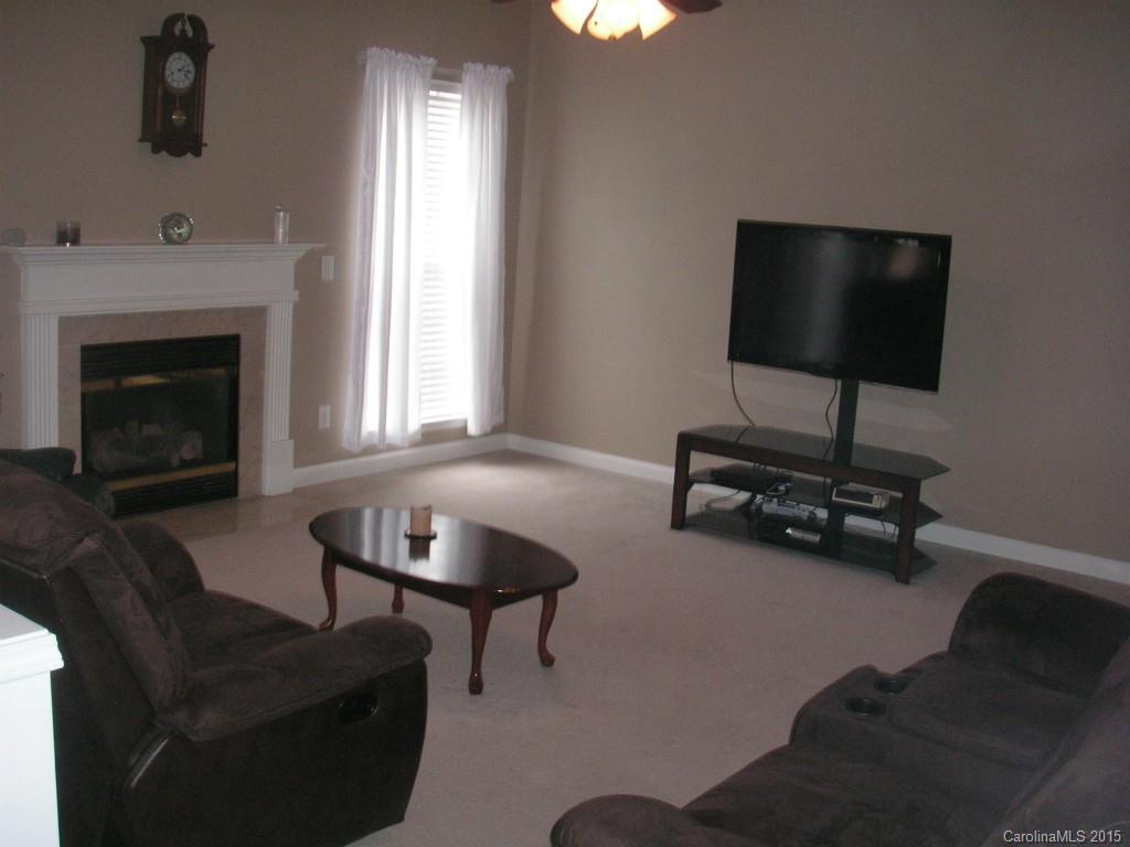 312 Altovista Court Fort Mill, SC 29708 - Photo 7 of 24 a living room with furniture and a fireplace