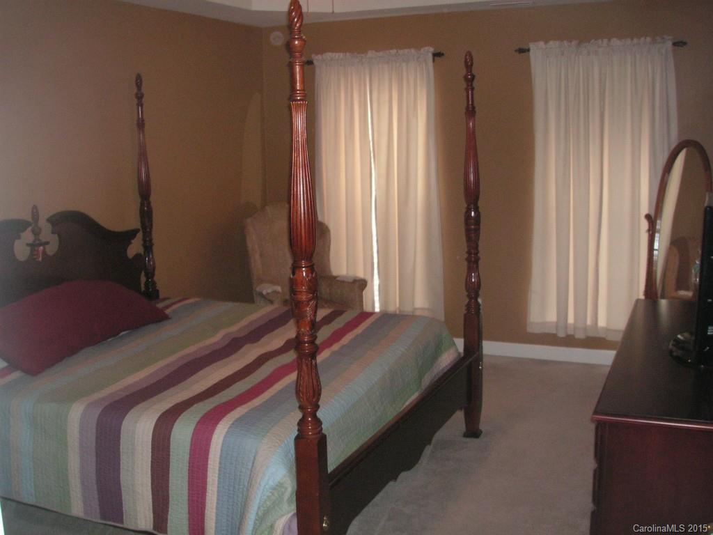 312 Altovista Court Fort Mill, SC 29708 - Photo 9 of 24 a bedroom with a bed and a window