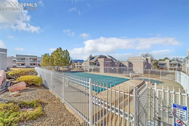 a view of balcony with two chairs and a table
