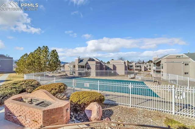 a view of a swimming pool with a lounge chair