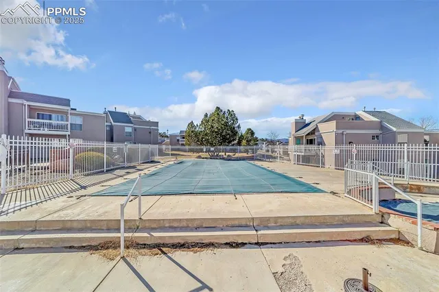 a view of a swimming pool with a buildings