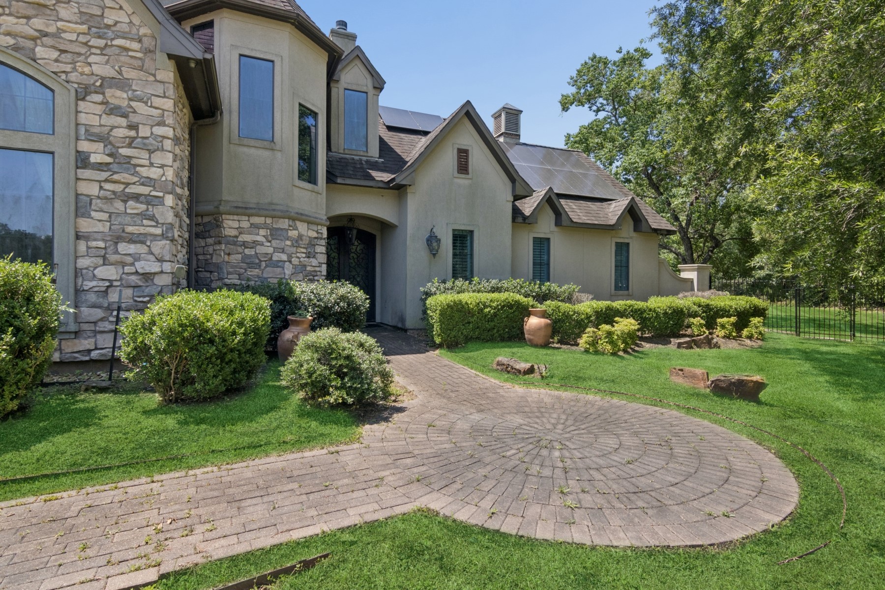 3818 Waterbend Cove Spring, TX 77386 - Photo 2 of 44 a view of a house with a small yard and potted plants