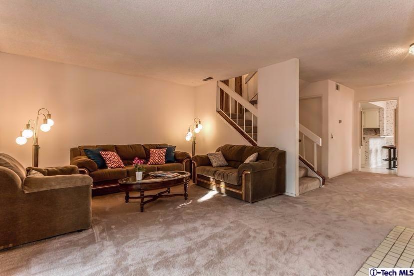 1333 Valley View Road, Unit 8 Glendale, CA 91202 - Photo 2 of 6 a living room with furniture and a lamp