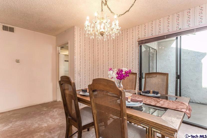 1333 Valley View Road, Unit 8 Glendale, CA 91202 - Photo 3 of 6 a living room with furniture and a chandelier
