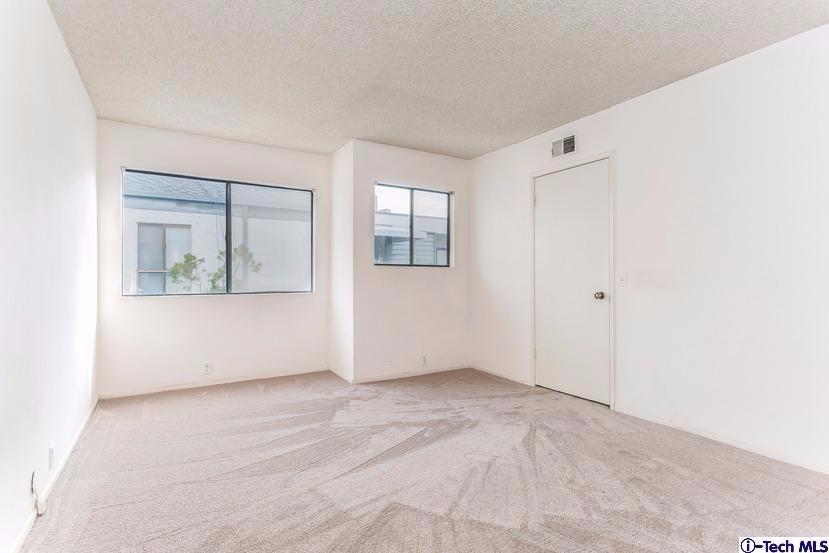 1333 Valley View Road, Unit 8 Glendale, CA 91202 - Photo 4 of 6 an empty room with windows and closet