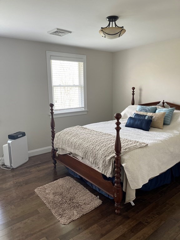 71 Narrows Road Freetown, MA 02702 - Photo 14 of 24 a bedroom with a bed and wooden floor